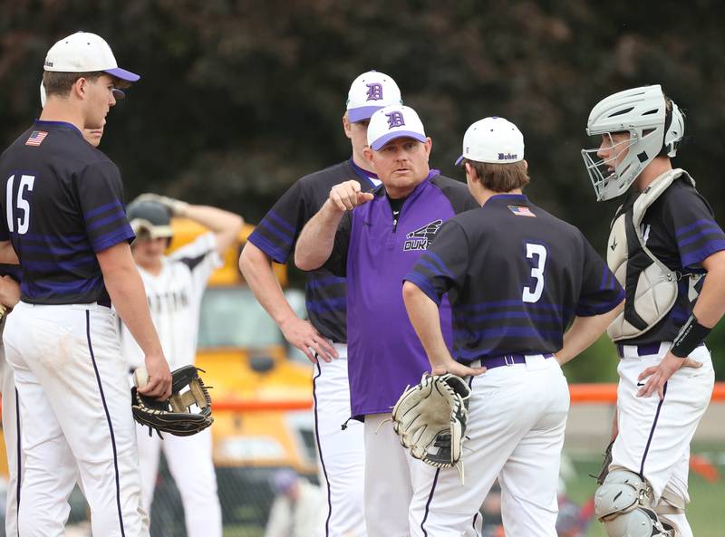 Dixon head coach Jason Burgess comes to the mound to talk to his infield Thursday, May 29, 2025, during their Class 3A regional semifinal game against Sycamore at Freeport High School.