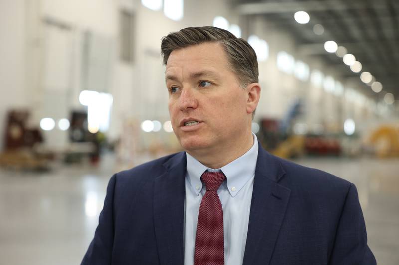 Doug Pryor, President and CEO for the Will County Center of Economic Development, speaks to a reporter during a press conference and interactive tour of the Lion Electric vehicle manufacturing facility. Monday, Mar. 21, 2022, in Joliet.