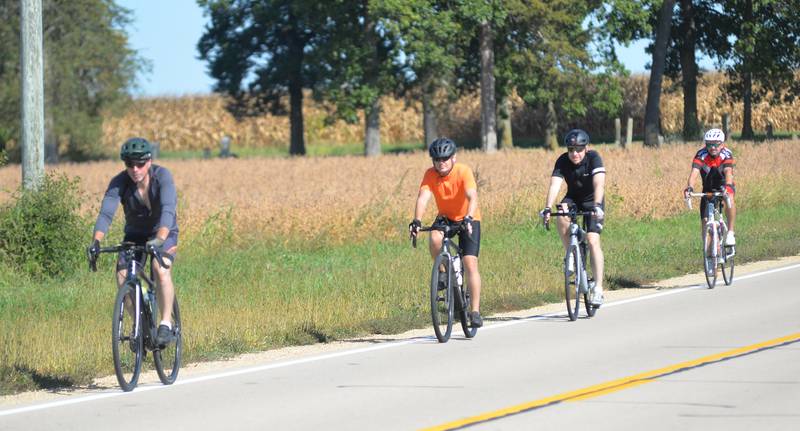 Four bicyclists ride south on Ridge Road during the 10th annual TOSOC (Tour of Scenic Ogle County) on Saturday, Sept. 27, 2025. The event is an annual fundraiser for the Village of Progress in Oregon.