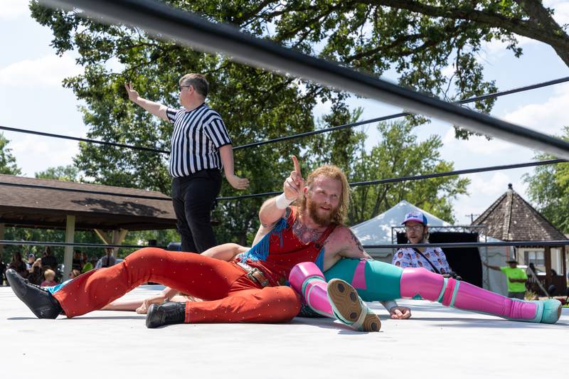 Kody Lane wags finger 'no' at crowd whilst covering Jake Bosche at the Taste of the Illinois Valley DreamWave Wrestling event on Saturday, August 2, 2025 at Centennial Park in Peru.