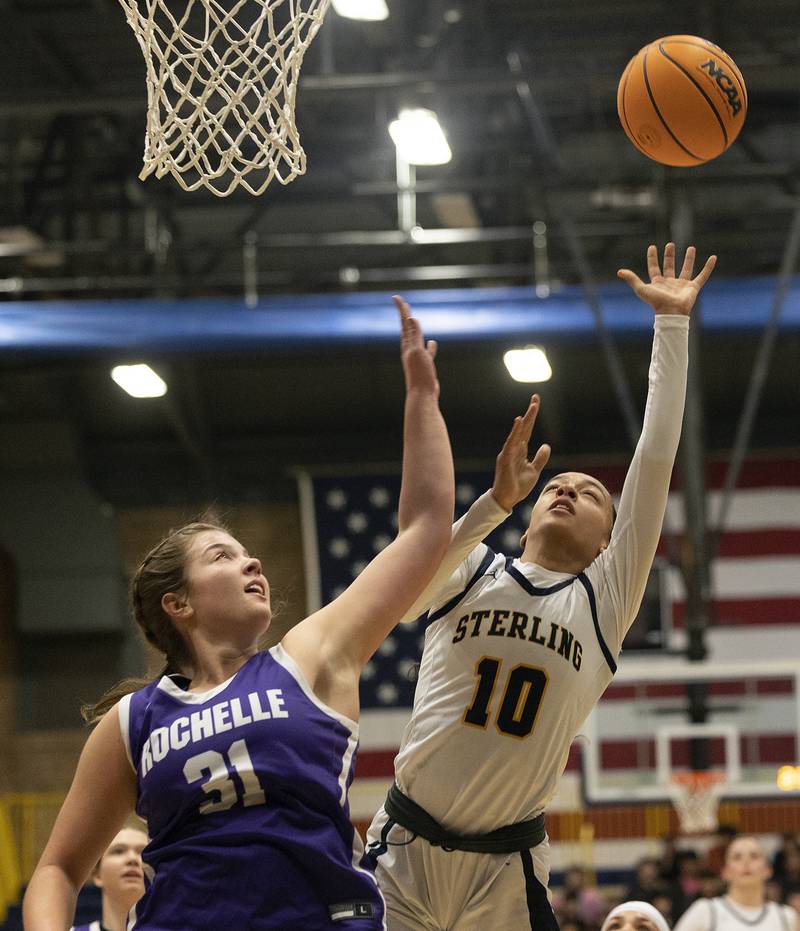 Sterling’s Nia Harris puts up a shot against Rochelle’s Kendyl Darby Monday, Feb. 17, 2025, during the girls 3A regional semifinal game in Sterling.