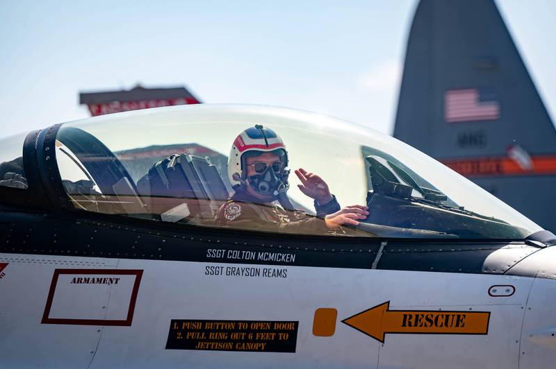 Captain Mitchell "Shadow" King, F-16 VDT waves from his gray F-16 upon his arrival at Peru Municipal Airport on Thursday, May 15 2025