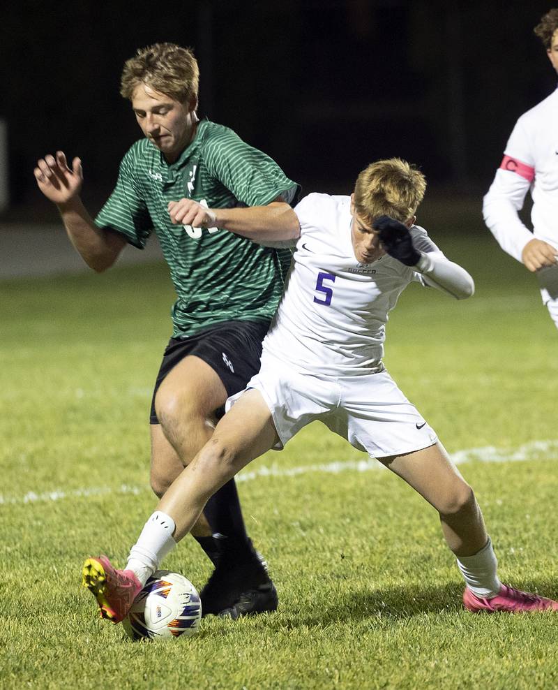 Dixon’s Nolan Valk works against Geneseo’s Jame Matthews Wednesday, Oct. 23, 2024, during the class 2A soccer regional in Geneseo.