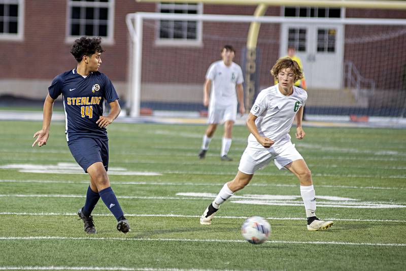 Sterling’s Adrian Lara plays the ball upfield against Geneseo Tuesday, Sept. 20, 2022.