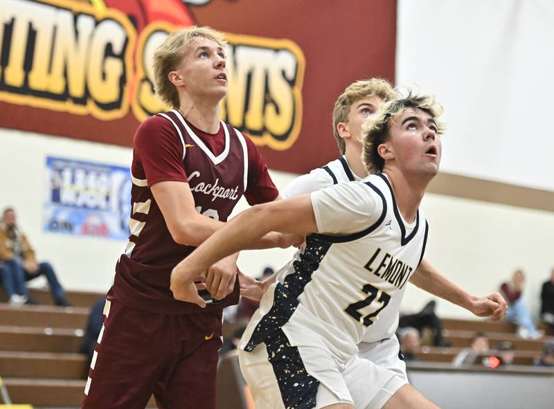 Lemont's Zane Schneider (22) blocks out Lockport's Nojus Venckus (10) during the WJOL tournament championship game on Saturday, NOV. 29, 2025, at Joliet.