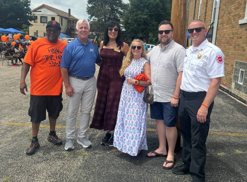 Event organizer Jaron Nabors Sr., Joliet Mayor Terry D’Arcy, Joliet City Councilwoman Suzanna Ibarra, xxxx, xxxx, and Joliet Fire Chief Jeff Carey pose for a photo at the Healing the Hood event held at the St. Mark CME Church in Joliet on Saturday June 29, 2024.