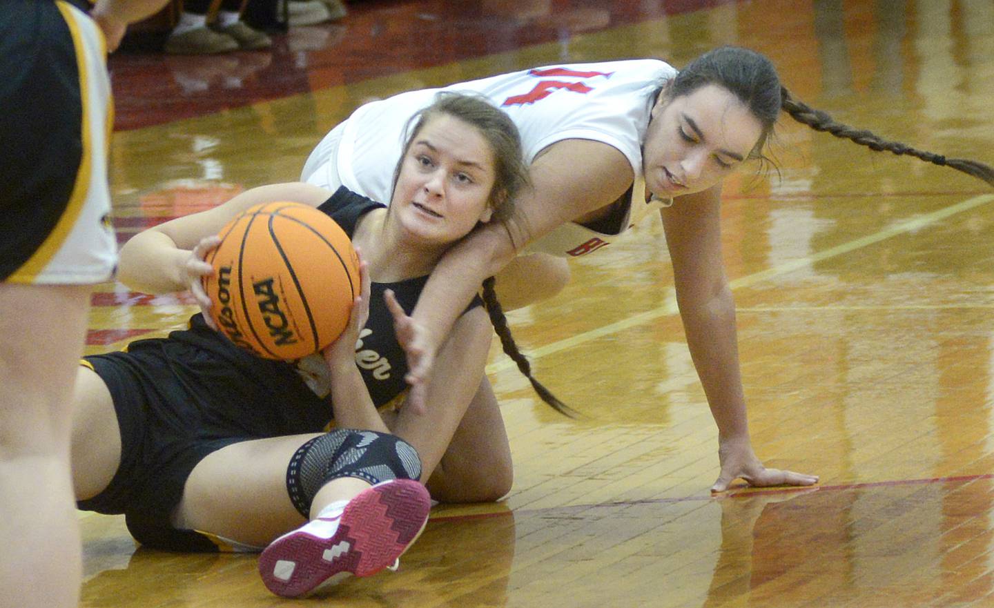 Herscher’s Avery Wright and Streator’s Isabel Gutierrez battle for a loose ball in the 1st period Thursday at Streator.