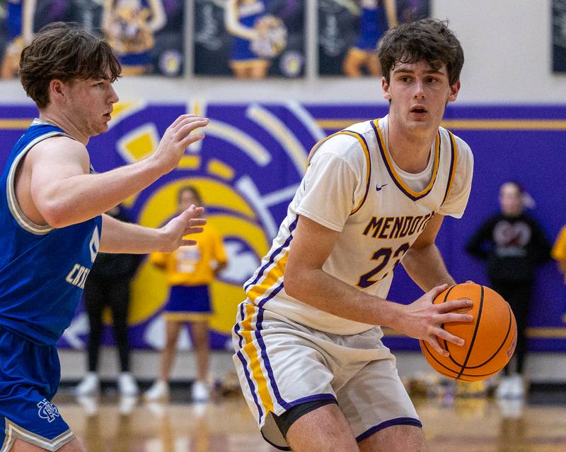 Mendota's Dane Doyle (23) holds ball looking for pass in game against Newman Central Catholic on Friday, January 30, 2026 at Mendota High School in Mendota.