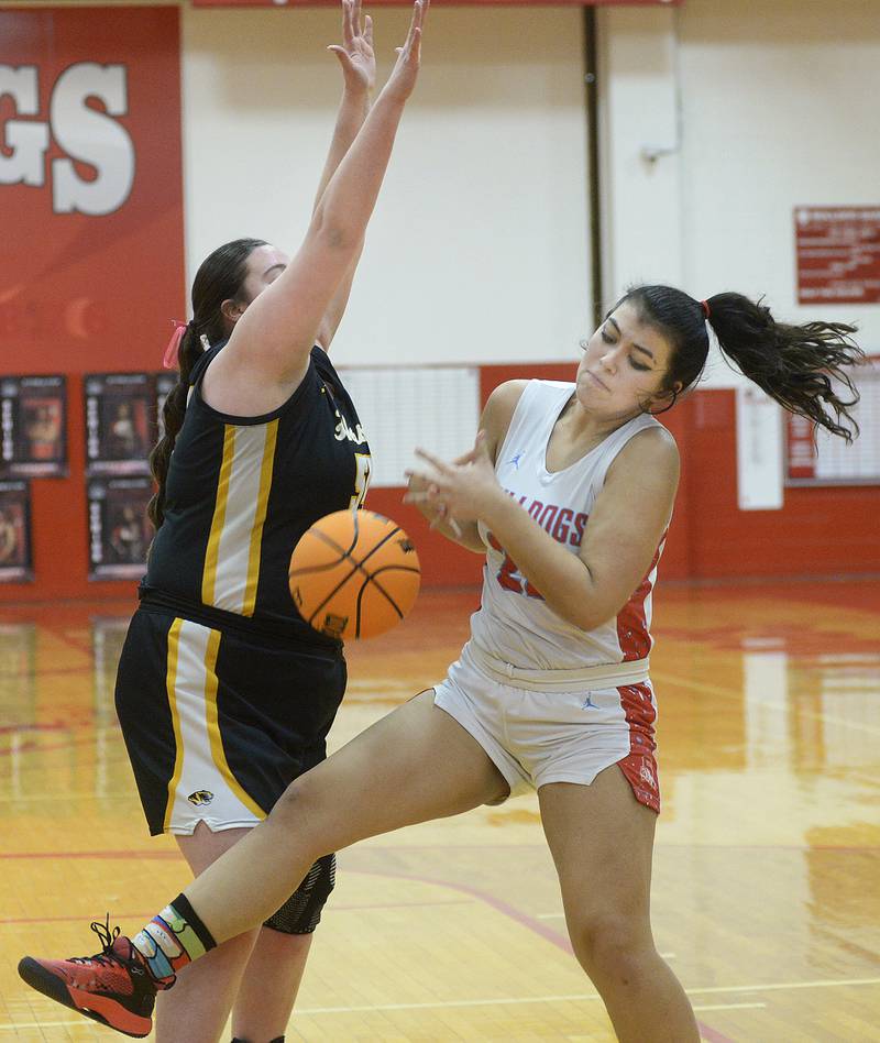 Streator’s Alexis Thomas pulls this rebound down ahead of Herschel’s Anistin Hackley in the 1st period Thursday at Streator.