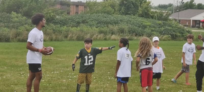 NIU defensive back and DeKalb grad Jordan Gandy plays a pick-up game after camp on Sunday, July 24, 2022 at the Youth Pride Foundation Skills and Drills Football camp.
