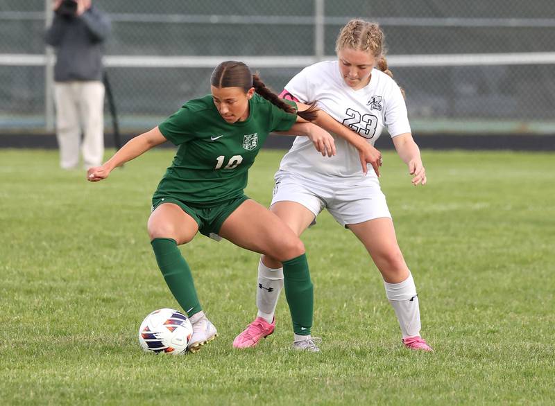 Kaneland's Lindsey Stoddard tries to get the ball from Boylan's Ava Galluzzo Wednesday, May 28, 2025, during their Class 2A sectional semifinal game at Belvidere High School.