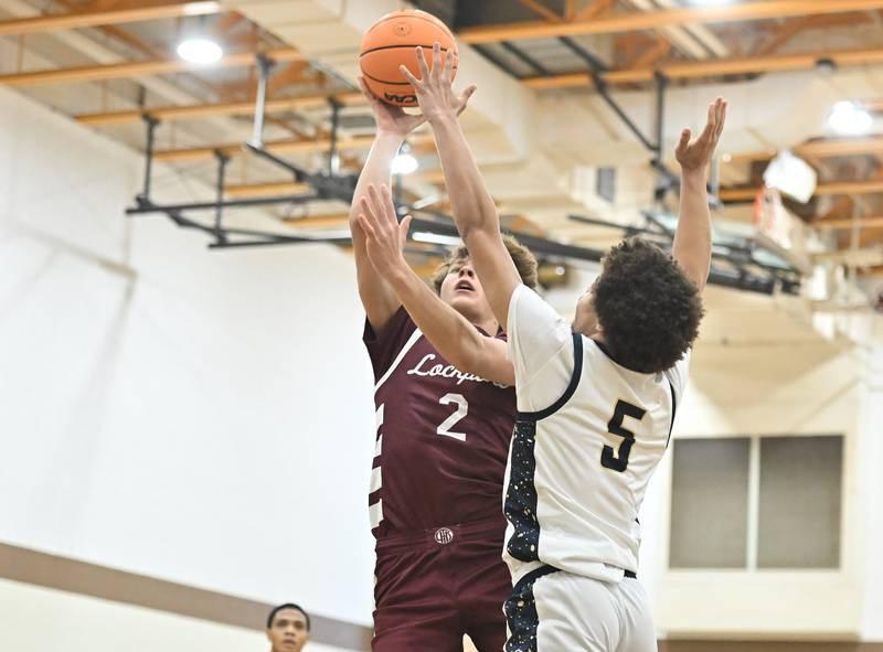 Lockport's Kajus Zubelis shoots over Lemont's Julian Overton during the WJOL tournament championship game on Saturday, NOV. 29, 2025, at Joliet.