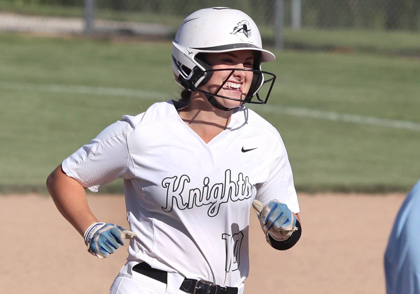 Kaneland's Emily Olp is all smiles as she rounds the bases after hitting a 3-run homer that put the Knights up 3-0 on Belvedere North Friday, June 3, 2022, during their IHSA Class 3A Sectional final game at Sycamore High School.