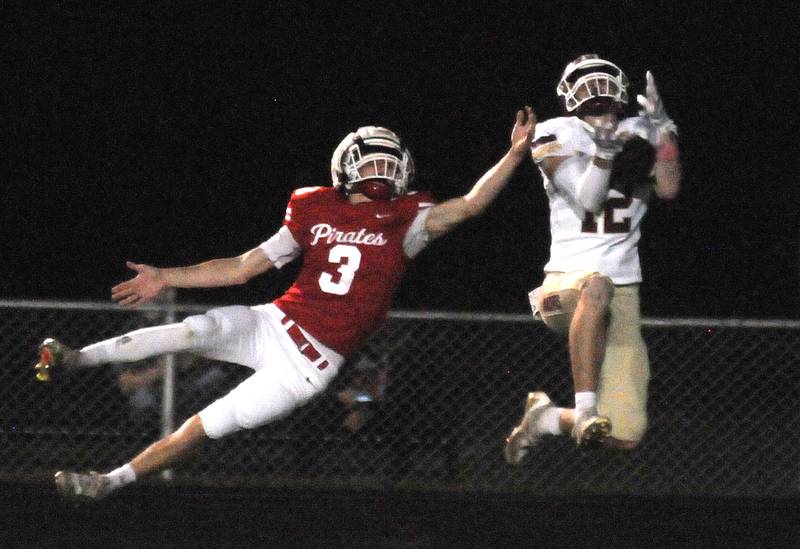 Morris' R.J. Kennedy (12) receives a touchdown past despite Ottawa's George Shumway's coverage on Friday, Oct. 10, 2025 at King Field in Ottawa.