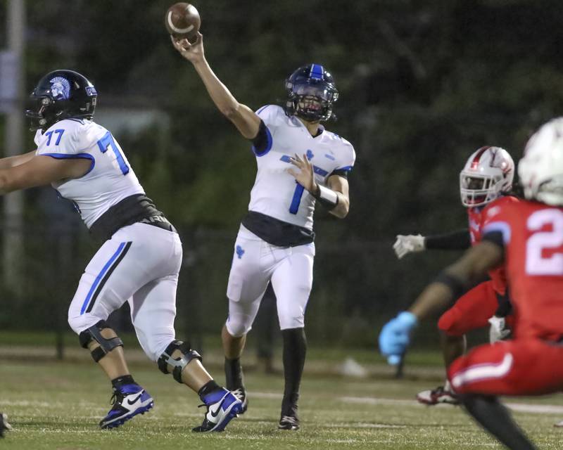 St. Francis's Brock Phillip (1) unleashes a deep pass during football game between St. Francis at Kenwood Academy on Thursday, Aug 28, 2025  in Chicago.