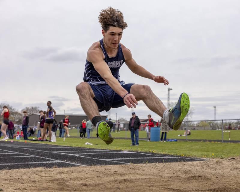 Michael Beckett of Fieldcrest High School leaps through the air during the boys long jump event during the Rollie Morris Invite on April 19, 2025 at Hall High School.