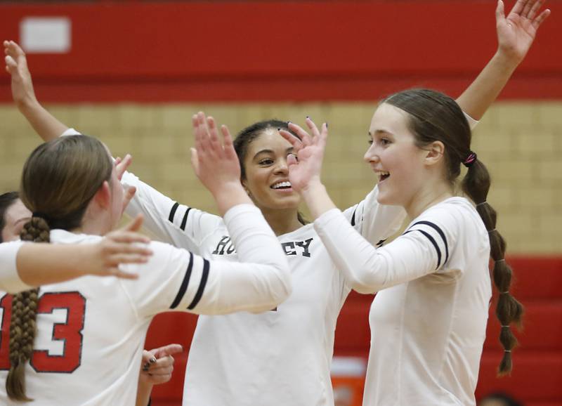 Huntley's Laura Boberg, (left) Morgan Jones and Jocelyn Erling celebrate a point during the IHSA Class 4A Rockford East Regional Volleyball Championship match against Dundee-Crown on Thursday, Oct. 26, 2023, at Rockford East High School.