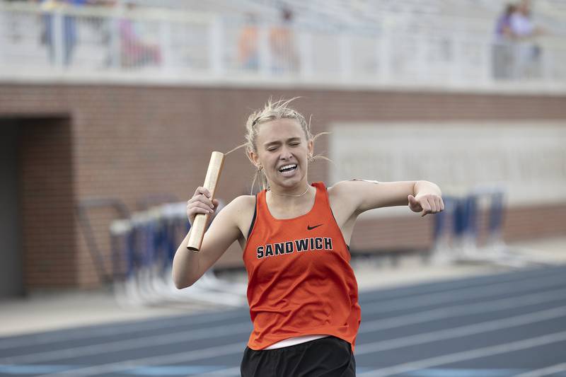 Sandwich’s Kayla Kressin finishes her team’s qualifying 4x800 race Wednesday, May 14, 2025, during Sectionals at Sterling High School.