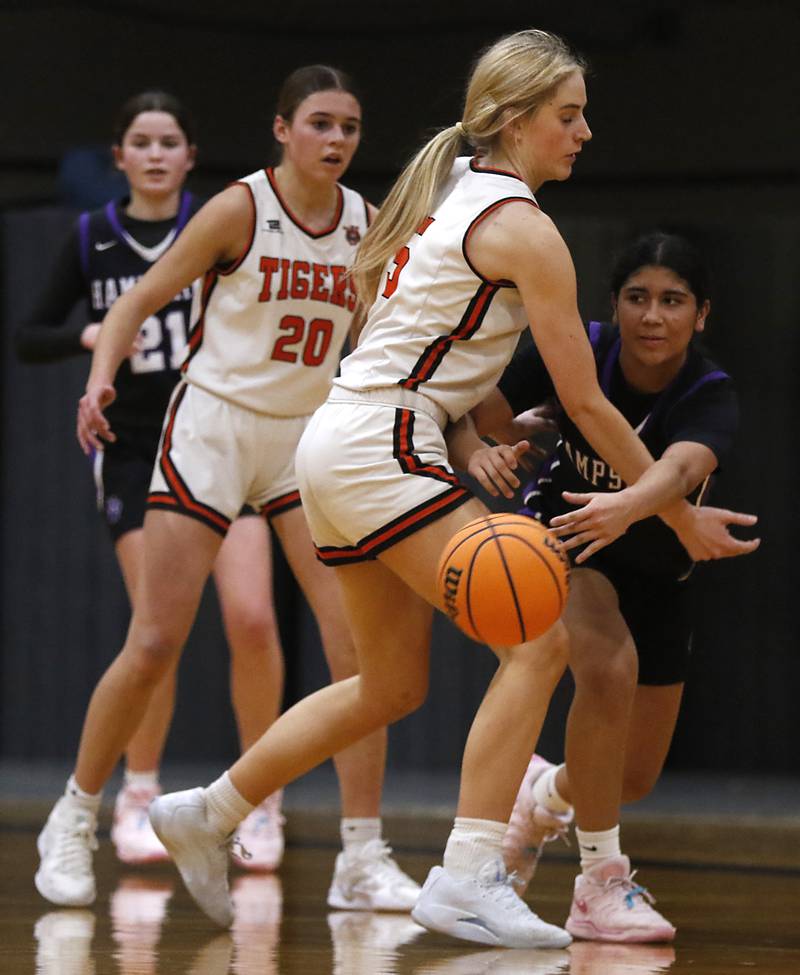 Hampshire's Jiselle Lopez tries to pass away from the defense of Crystal Lake Central's Ruby Macke during a a Fox Valley Conference basketball game on Friday, Feb. 7, 2025, at Crystal Lake Central High School.