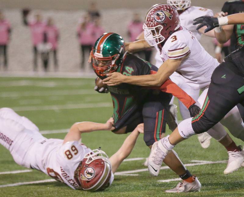 L-P's Tre'von Hunter (no,34) is brought down by Morris's Sam Reddinger (no,3) on Friday Oct. 15, 2021.