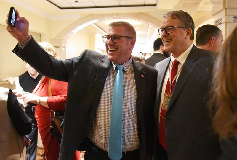 Former Illinois governor Republican candidate Darren Bailey, left, takes a photo with Bob Kelsey of Berwyn during Friday's McHenry County GOP committee fundraiser event in Addison.