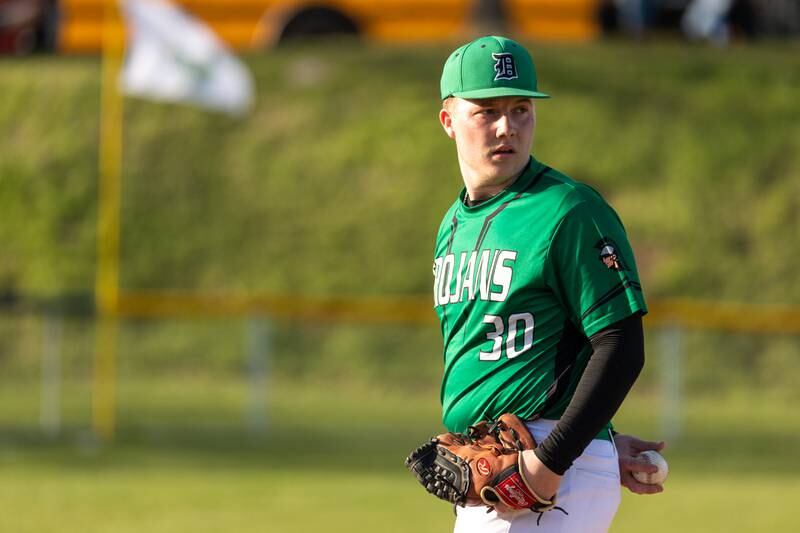 Wyatt Statler (30) of Dwight checks runner on first base before pitching to batter on Tuesday, April 15, 2025 at St. Bede Academy in Peru.