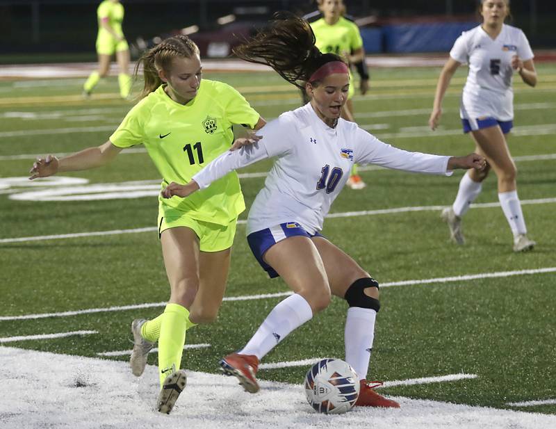 Richmond-Burton's Margaret Slove battles with Johnsburg's London Baidinger for control of the ball during Kishwaukee River Conference Girls Soccer  Tournament Championship Match Wednesday, May 3, 2023, at Richmond-Burton High School.