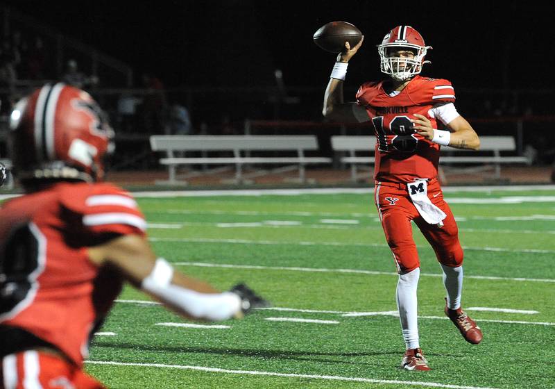 Yorkville quarterback Jack Beetham (18) targets running back Tavaris Harland, Jr against Bolingbrook on Friday, Sept. 27, 2024, during a varsity game at Yorkville High School.
