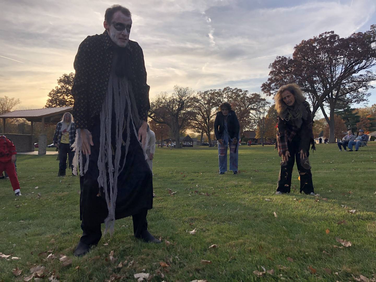 Performers in TSC studios' "Thriller" flash mob perform the Thriller dance Saturday, Oct. 29, 2022 in Centennial Park in Peru.