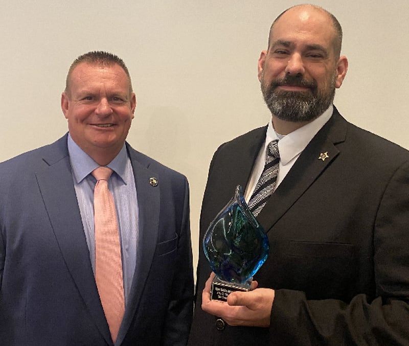 Whiteside County Sheriff John Booker (left) with Detective Sgt. Michael S. Leighton. Leighton was awarded the Illinois Coalition Against Sexual Assault's 2022 Moxie Award on Thursday, May 26, 2022 in Springfield.
