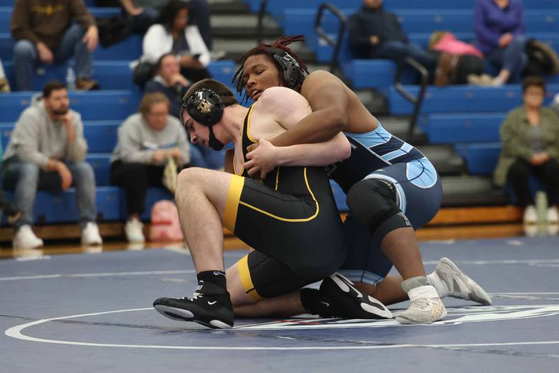 Joliet West’s Jacob Tyderek and Plainfield South’s Jamal Jones Jr. face off in the 215-pound match on Wednesday, Dec. 11, 2024 in Plainfield.
