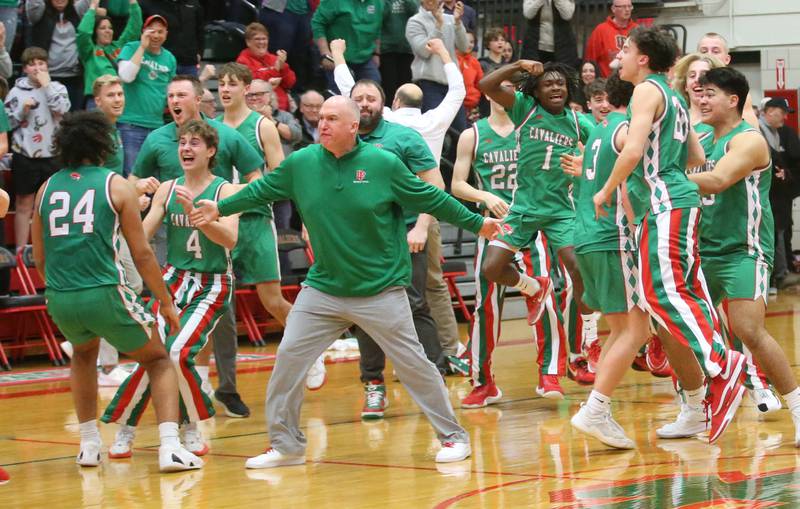 Members of the L-P basketball team react after defeating Streator to win the Class 3A Regional title on Friday, Feb. 28, 2025 in Sellett Gymnasium at L-P High School.