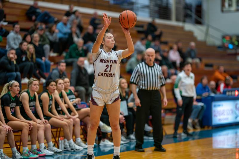 Montini’s Alyssa Epps (21) shoots a three-pointer against Providence during the 3A Glenbard South Sectional basketball final at Glenbard South High School in Glen Ellyn on Thursday, Feb 23, 2023.