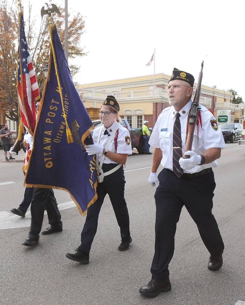 Ottawa American Legion Post 33 leads the Marquette Academy High Homecoming parade Wednesday in Ottawa.