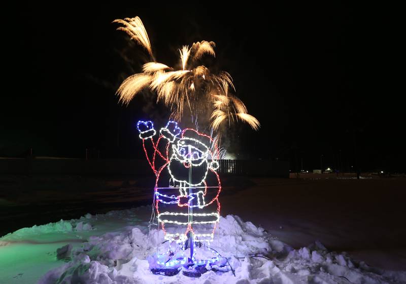 Fireworks fill the sky above Santa Claus during the Christmas Fireworks Spectacular on Saturday, Dec. 6, 2025 at the Bureau County Fair in Princeton.
