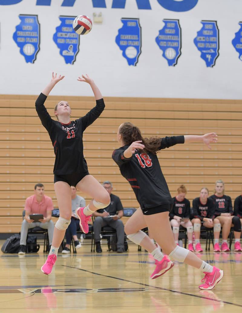 Benet's Ellie Stiernagle (11) sets the ball for Sophia Pursley (18) against the St. Charles North during a game on Wednesday, September 20, 2023.