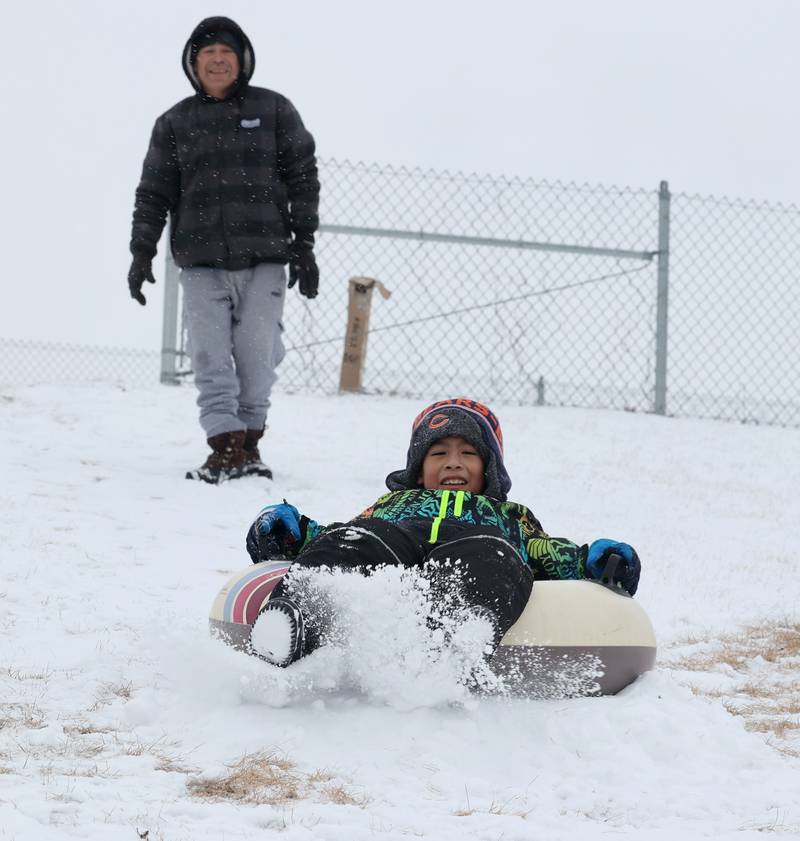 Christopher Rodriguez Ovando, 9, from 
Tijuana, Mexico, enjoys the sled hill Wednesday, Feb. 12, 2025, at Hopkins Park in DeKalb. Ovando is in DeKalb visiting friends and this is his first time seeing snow.