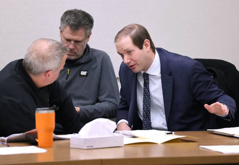 DeKalb Mayor Cohen Barnes (left) talks to city attorney Matt Rose Friday, Jan. 13, 2023, during a City of DeKalb Electoral Board hearing. The hearing was held to decide if incumbent Scott McAdams, who is running unopposed for DeKalb’s 5th Ward aldermanic seat, should be removed from the ballot due to objections filed by two residents regarding signatures and filing procedure.