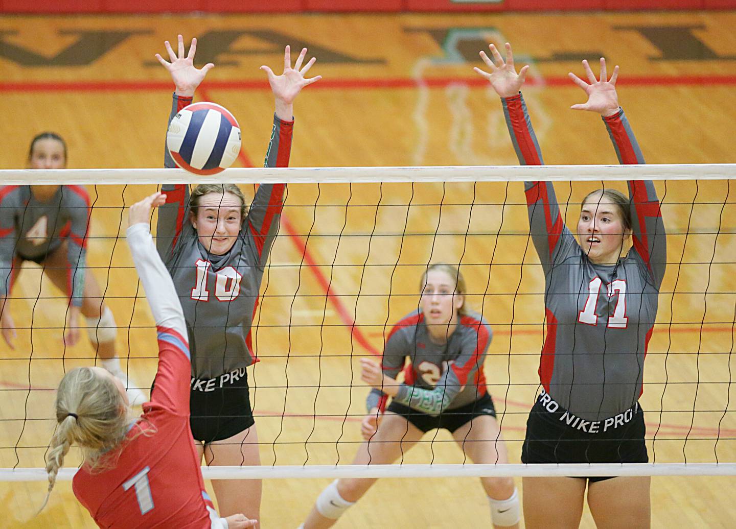 La Salle-Peru's Katie Sowers (10) and teammate Olivia Shetterly jump to block a kill from Ottawa's Ryleigh Stevenson (7) on Thursday Sept. 22, at A.J. Sellett Gymnasium.