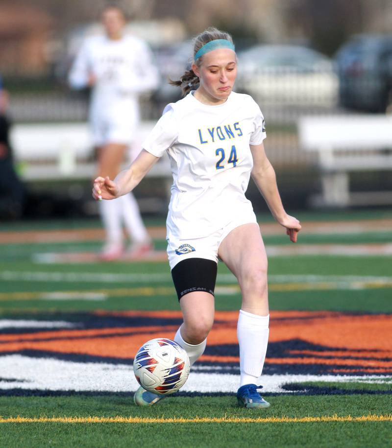 Lyons Township's Avery Lusk kicks the ball during a game against Naperville North on Wednesday, April 16, 2025 in Naperville.