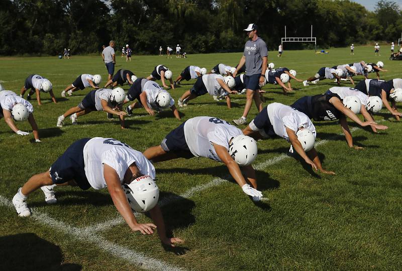 Cary-Grove’s football team does conditioning drills during Cary-Grove’s first football practice of the upcoming season on Monday, August 11, 2025, at Cary-Grove High School.