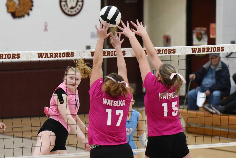 Cissna Park's Sophie Duis, left, watches as Watseka's Taylor Chattic, left, and Gabby Kohl look to block her hit during a game at Watseka Tuesday, Oct. 21, 2025.