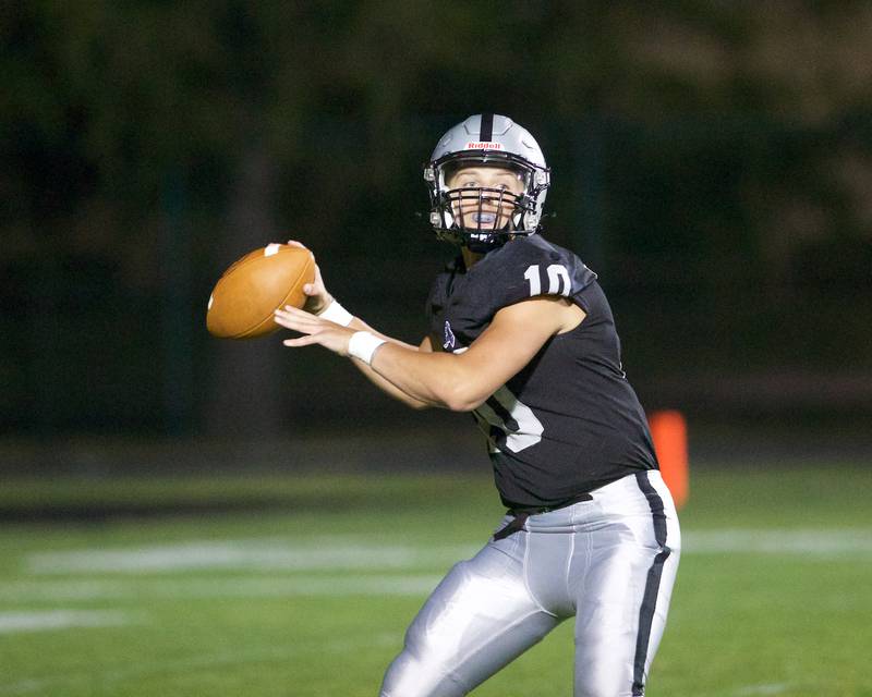Kaneland's Troyer Carlson looks to make the pass against Morris on Friday, Sept. 8, 2023 in Maple Park.