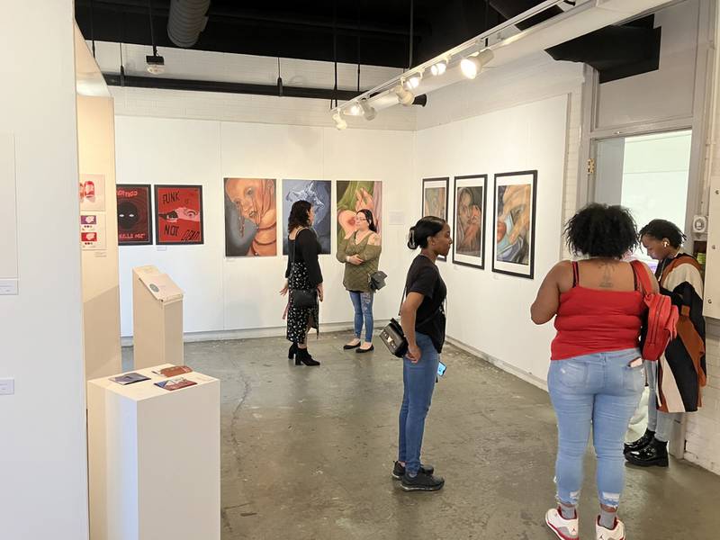 People gathering in the Jack Olson Gallery at Northern Illinois University in DeKalb in this undated photo.
