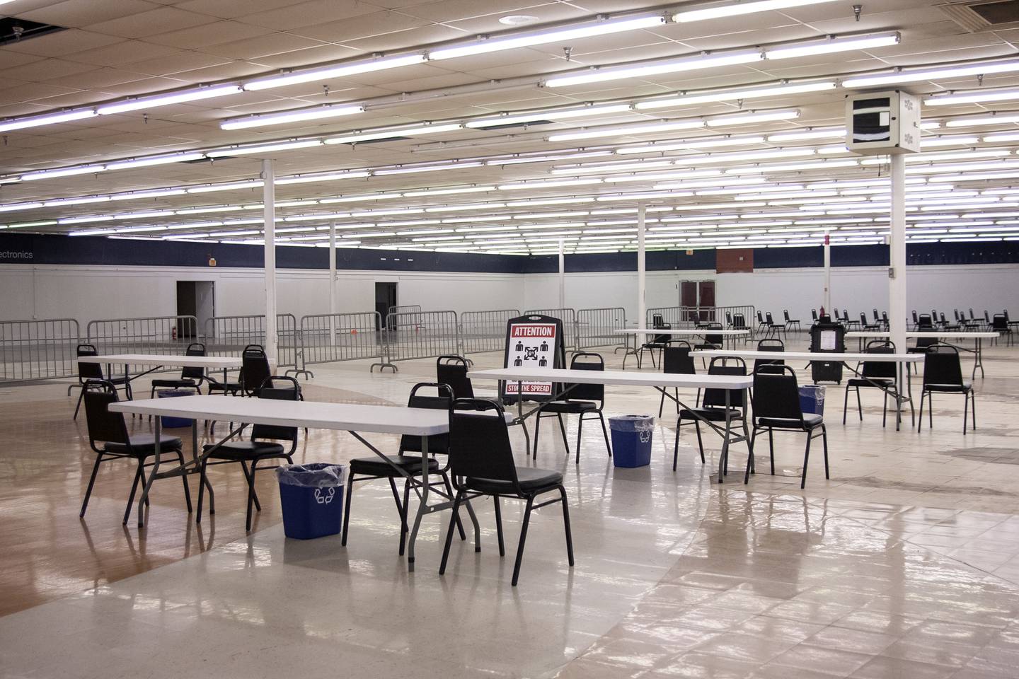 Chairs and tables are arranged Thursday, Feb. 18, 2021, for COVID-19 vaccinations at the former Kmart at 1900 N. Richmond Road.