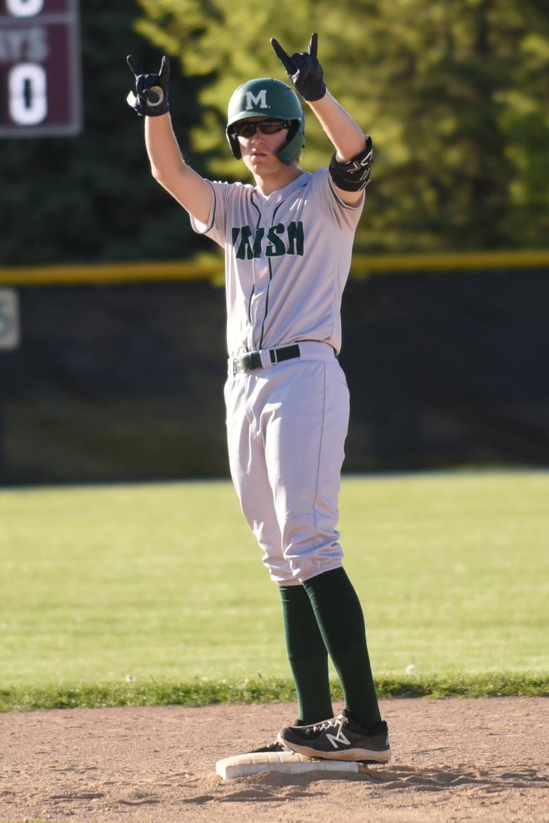 Bishop McNamara's Callaghan O'Connor gestures towards the Fightin' Irish dugout after hitting a double during a game at Kankakee Friday, May 9, 2025.