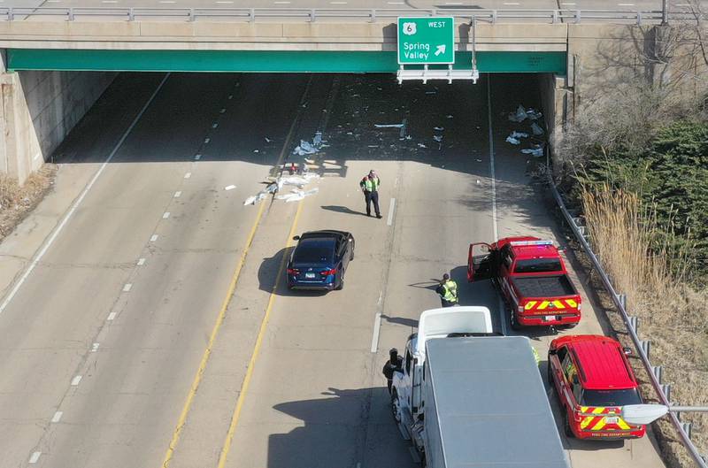 Debris covers Illinois Route 251 as a semi truck struck the U.S. Route 6 overpass on Monday, March 30, 2026 in Peru. Traffic was closed in both northbound and southbound directions on Illinios Route 251. Peru Police and Fire were on the scene. The incident happened shortly before 10a.m.