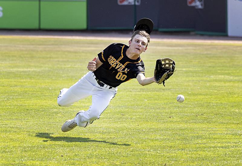 Goreville’s Grant Krack dives but can’t come up with a ball off the bat of Newman’s Kyle Wolfe Saturday, June 3, 2023 during the IHSA class 1A third place baseball game.