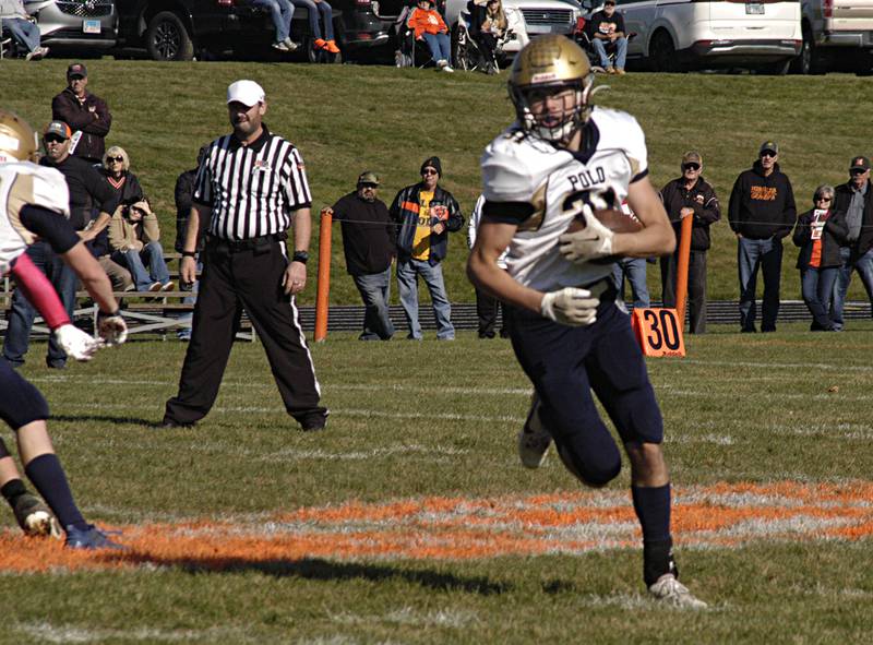 Polo's Noah Dewey picks up yards against Milledgeville in round 2 of  the 18FA football bracket in November 2023 at Milledgeville.