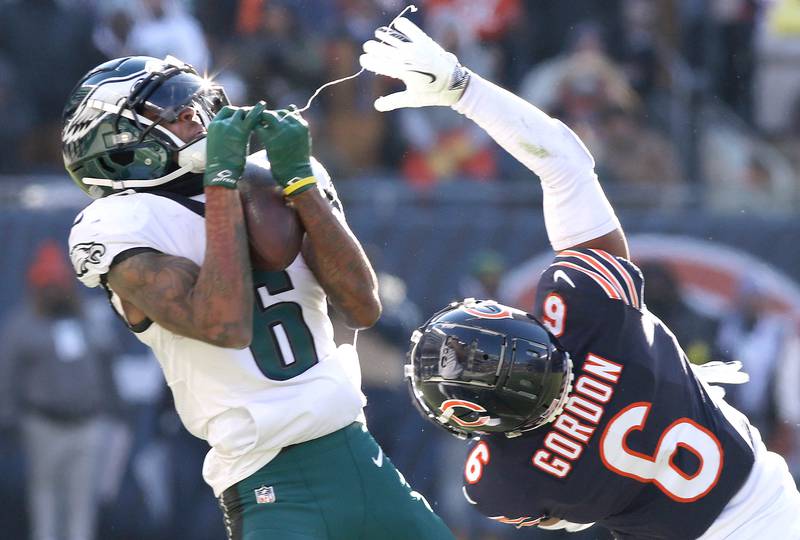 Philadelphia Eagles wide receiver DeVonta Smith catches a long pass behind Chicago Bears cornerback Kyler Gordon late in the first half of their game Sunday, Dec. 18, 2022, at Soldier Field in Chicago.